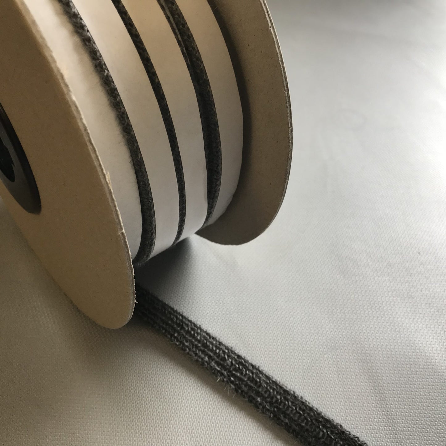 TSEC Flat Stove Rope Self Adhesive - Black or White - The Seal Extrusion Company LTD